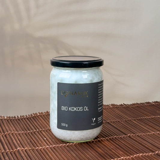 Weißer Glasbehälter mit DynamikPlus "Bio Kokos Öl" Etikett und schwarzem Drehverschluss